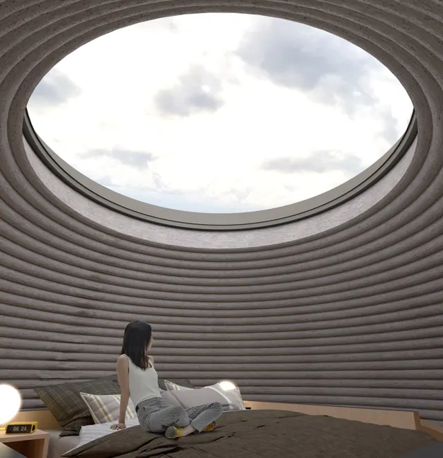 Inside the shell: rings of printed earth rise to a wide round skylight above a bed where a woman sits