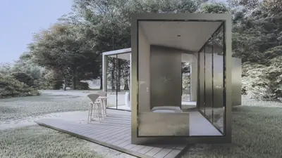 A glass and metal box open at one end, on a timber deck among frosty trees