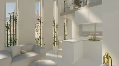 A white living room with a sofa, a kitchen and bamboo in tall narrow windows