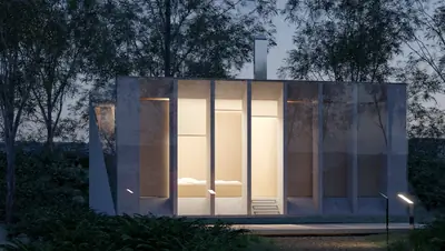 A concrete cabin at dusk among trees, lit through tall narrow openings