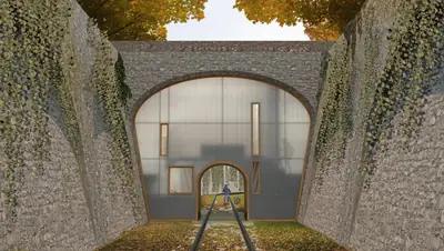 A glass home filling the stone arch of an old railway bridge, ivy on the walls, rails leading in