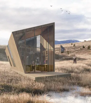 A leaning timber and glass house on a dry, grassy plain with hills behind