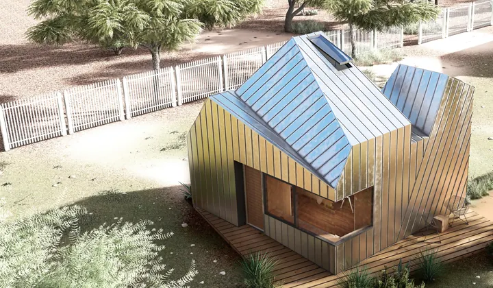 Pocket House from above: faceted walls and roofs in metal, a deck and a white picket fence