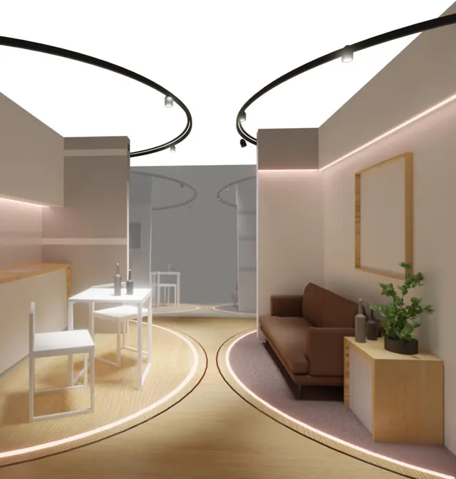 The central room with its turntables marked by rings of light in the floor, a sofa on one side and a table on the other