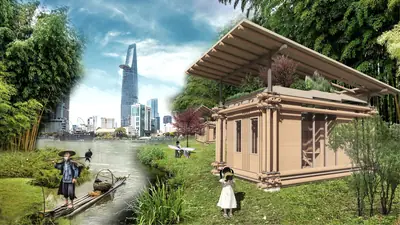A timber house under a wide sloping roof on a river bank, city towers across the water