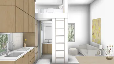 A small white kitchen with a ladder up to a bed in a loft