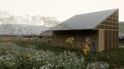 A long, low house in a field of flowers, a beekeeper at work beside it