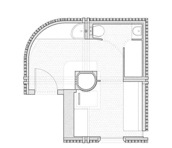 The floor plan: a curved wall, a round stair and a bathroom around one main room