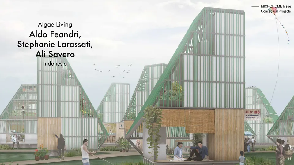 Algae Living: tall A-frames of green louvres over small homes in a village, with the project’s title