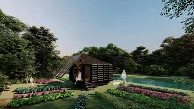 A dark timber home with green planted walls among flower beds and trees, by a pond