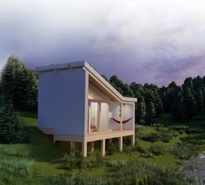 A blue house on stilts with a sloping roof and a glass front at the edge of a wood