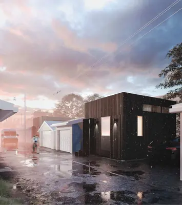 A small dark timber house at the end of a wet laneway at dusk
