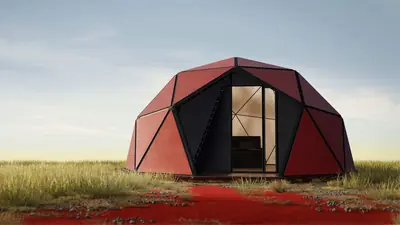 A red dome of triangular panels on a grassy plain, red earth around it