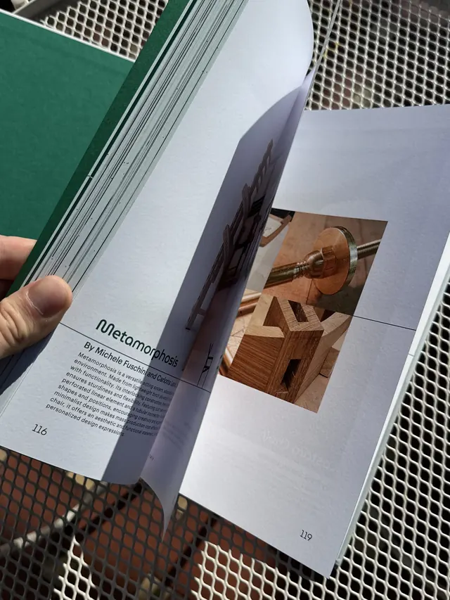 The book open at the Metamorphosis chair, pages turning