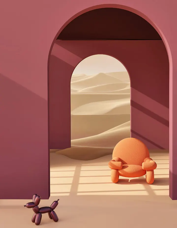 The Hug Chair in orange under a pink arch, a desert beyond