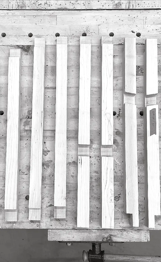 Black and white photo of the chair parts laid out