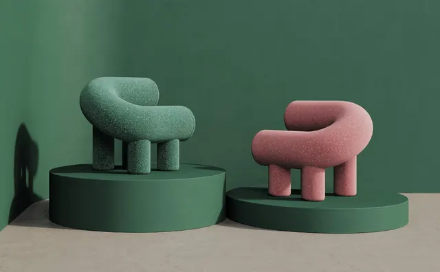 A green and a pink Umi Armchair on round green plinths