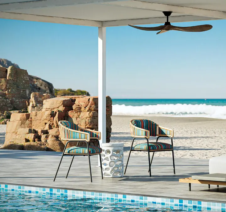 Two Akérelé Chairs on a terrace by the sea