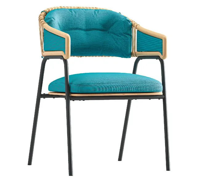 An Akérelé Chair with a teal cushion and a woven back
