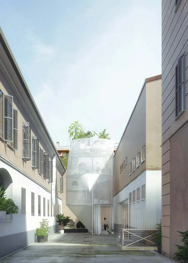 A narrow alley between old buildings with a translucent new block at its end